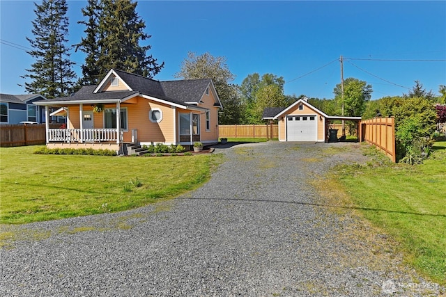 1517 Pioneer Hwy, Silvana, WA 98287 - view of front facade with a porch, a carport, gravel driveway, fence, and a front lawn