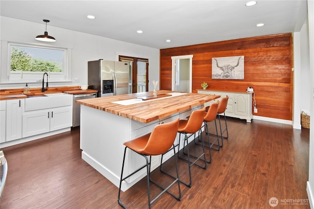 1517 Pioneer Hwy, Silvana, WA 98287 - kitchen with a sink, white cabinets, wooden counters, and stainless steel appliances