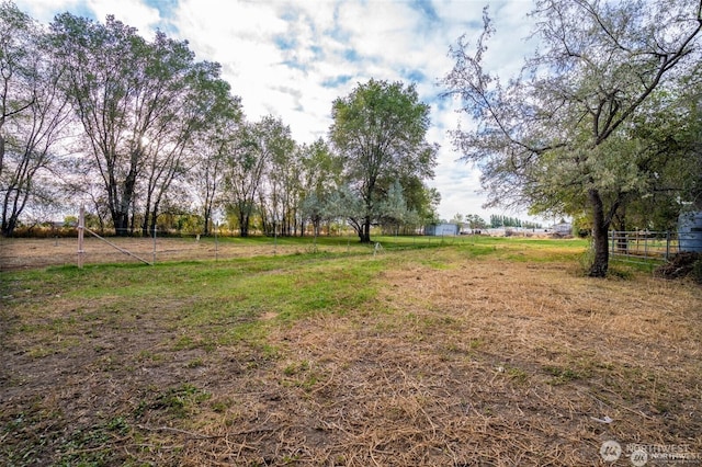 view of yard with a rural view