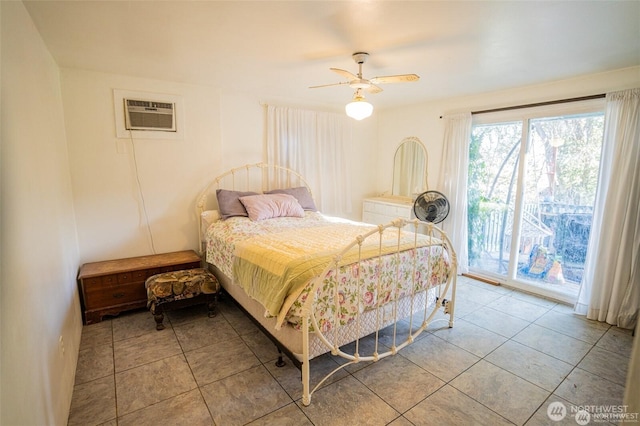 tiled bedroom with an AC wall unit, access to outside, and a ceiling fan