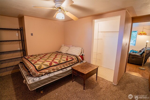 bedroom featuring carpet floors, ceiling fan, and a closet
