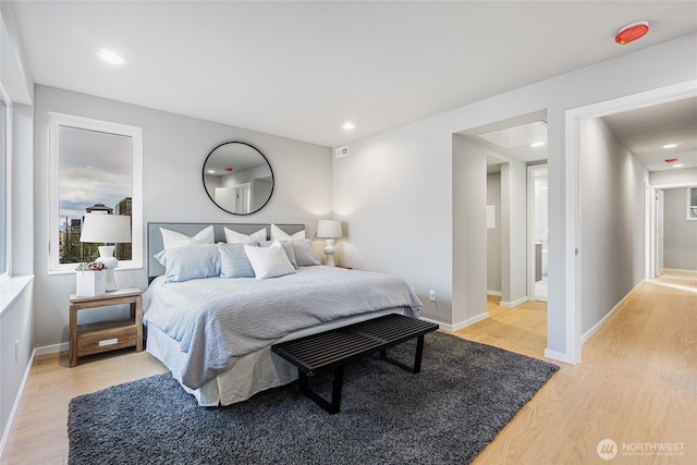 bedroom featuring recessed lighting, baseboards, visible vents, and light wood-style floors