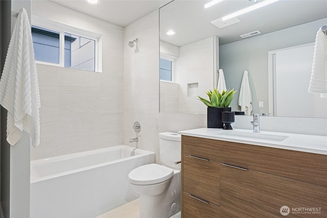 bathroom with washtub / shower combination, vanity, toilet, recessed lighting, and visible vents