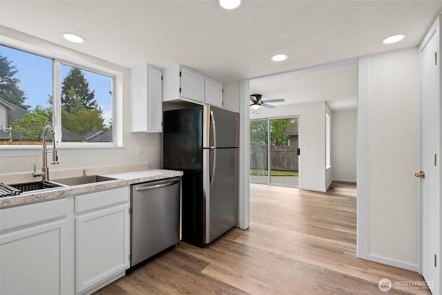 kitchen with ceiling fan, recessed lighting, white cabinetry, a sink, and appliances with stainless steel finishes