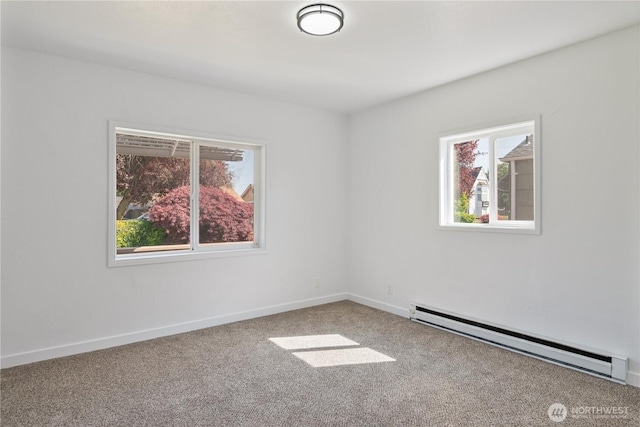 carpeted empty room with baseboards, a healthy amount of sunlight, and a baseboard radiator