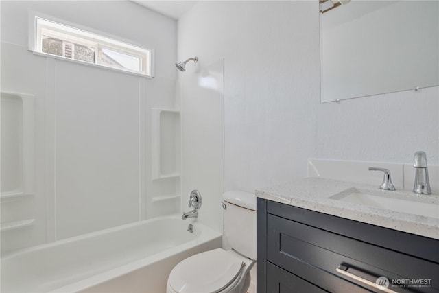 full bathroom featuring toilet, shower / washtub combination, and vanity