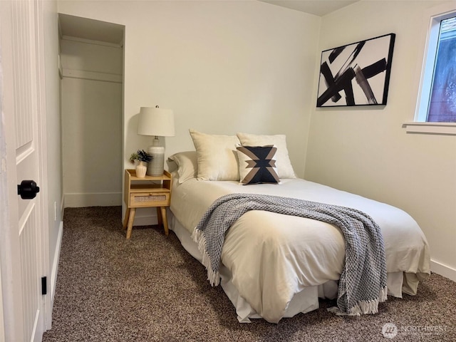 carpeted bedroom with baseboards