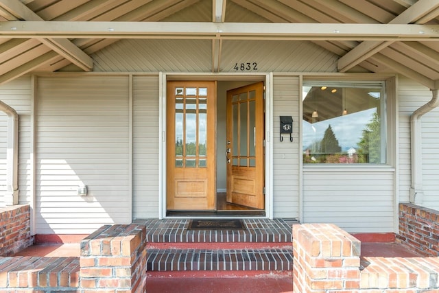 doorway to property with a porch