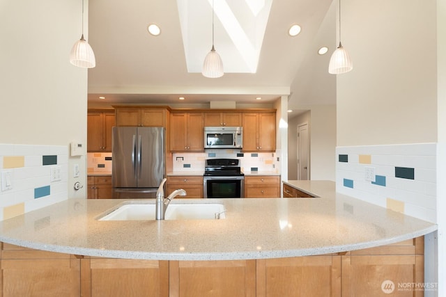 kitchen with decorative backsplash, a sink, light stone countertops, and stainless steel appliances