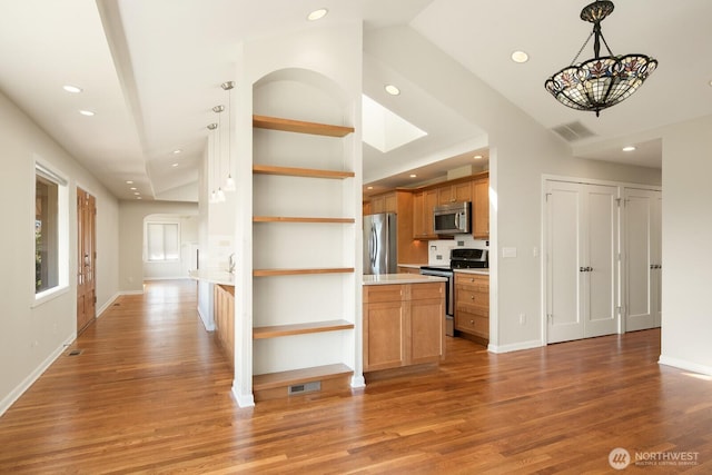 kitchen featuring open shelves, stainless steel appliances, recessed lighting, and visible vents