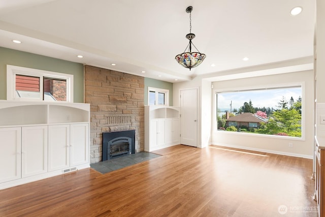unfurnished living room with visible vents, recessed lighting, and light wood-style flooring