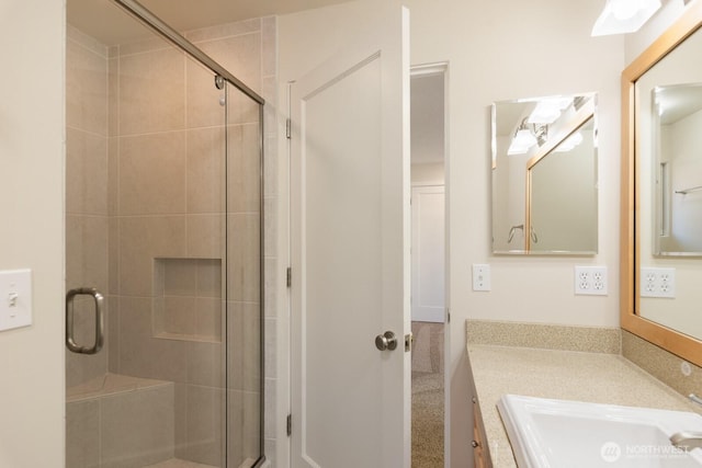 full bathroom with vanity and a stall shower