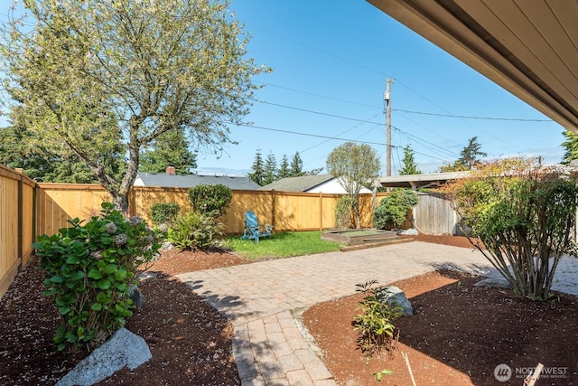view of yard with a patio and a fenced backyard