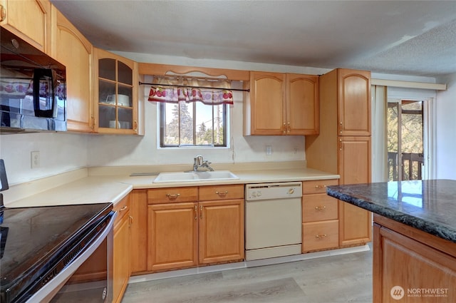 1917 E 60th St, Tacoma, WA 98404 - kitchen featuring black microwave, a healthy amount of sunlight, white dishwasher, stainless steel electric stove, and a sink
