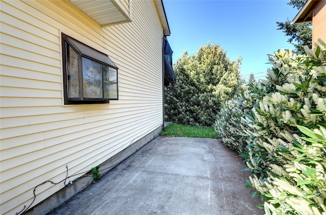 1917 E 60th St, Tacoma, WA 98404 - view of side of home featuring a patio