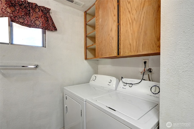 1917 E 60th St, Tacoma, WA 98404 - washroom with visible vents and separate washer and dryer