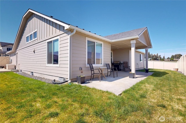 3 Gregory St, Milton-Freewater, OR 97862 - rear view of property with board and batten siding and a patio area