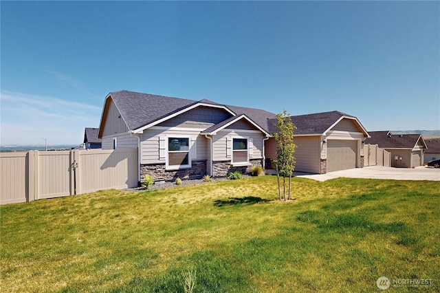 3 Gregory St, Milton-Freewater, OR 97862 - craftsman-style house featuring driveway, an attached garage, stone siding, and roof with shingles
