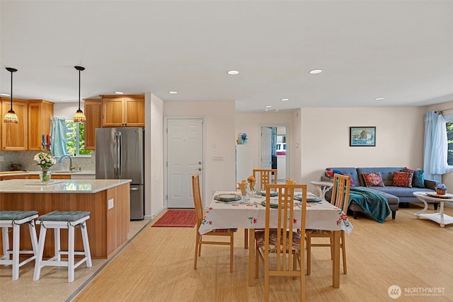 dining room featuring recessed lighting and light wood-style floors