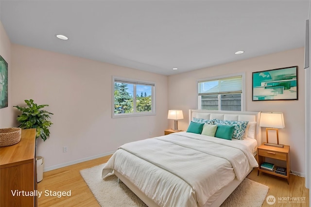 bedroom featuring light wood-style floors, baseboards, and recessed lighting