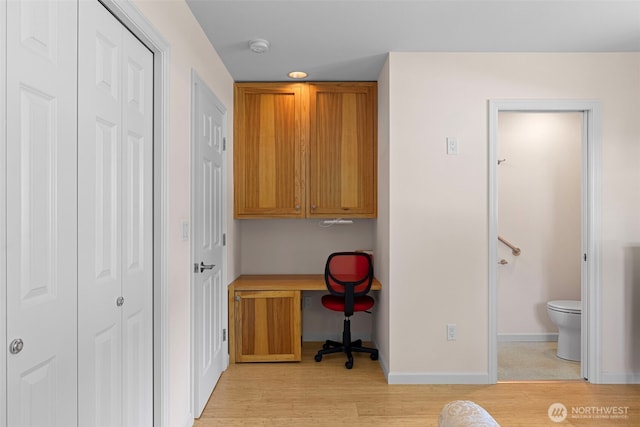 home office featuring light wood-style floors and baseboards