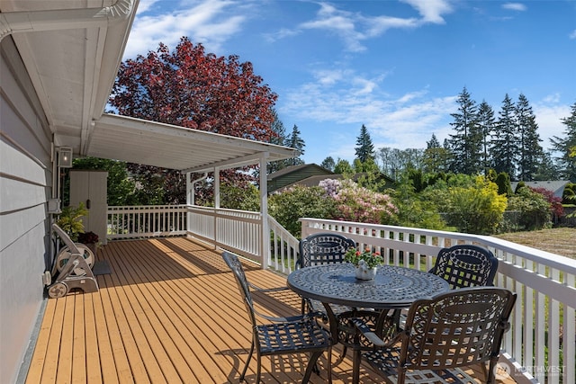 wooden deck with outdoor dining area