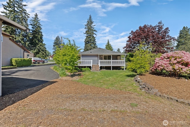 view of property exterior with a lawn