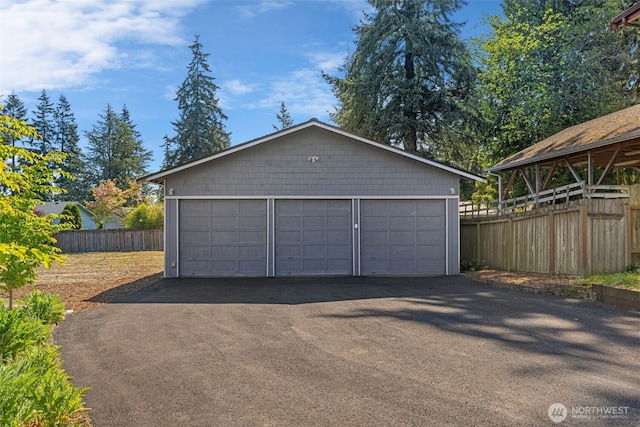 detached garage with fence