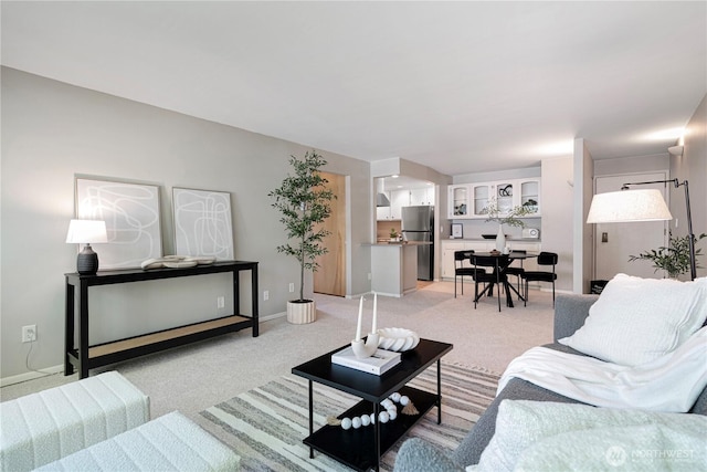 912 3rd Ave W Unit 303, Seattle, WA 98119 - living area with baseboards and light colored carpet