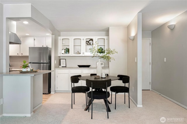 912 3rd Ave W Unit 303, Seattle, WA 98119 - dining room featuring light carpet, baseboards, and recessed lighting
