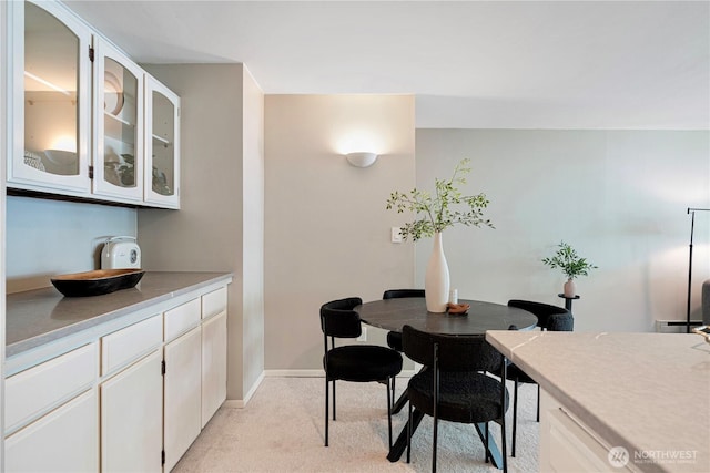 912 3rd Ave W Unit 303, Seattle, WA 98119 - dining space featuring light carpet and baseboards