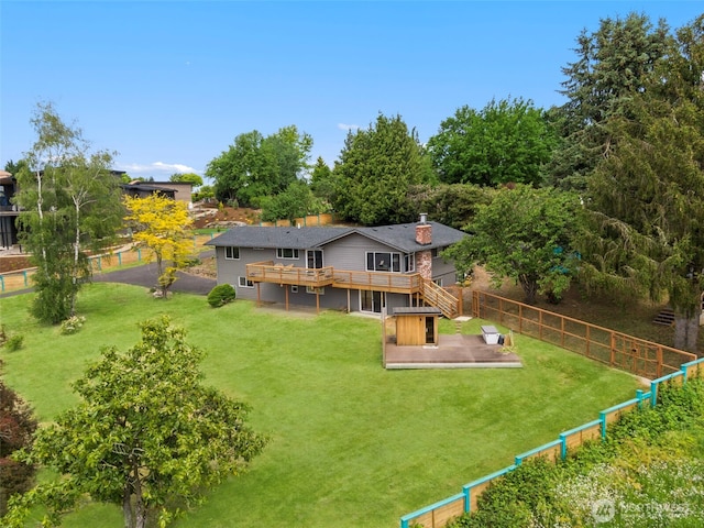 6409 NW 202nd Cir, Ridgefield, WA 98642 - back of house featuring a deck, a chimney, and stairs