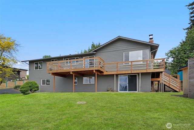 6409 NW 202nd Cir, Ridgefield, WA 98642 - rear view of house featuring a deck, stairs, a lawn, and a chimney