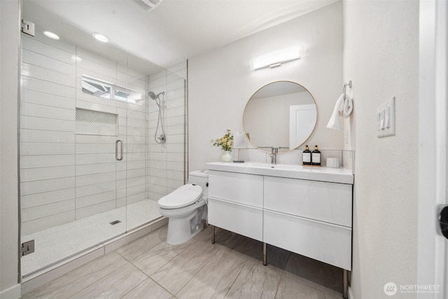6409 NW 202nd Cir, Ridgefield, WA 98642 - bathroom featuring toilet, a stall shower, and vanity