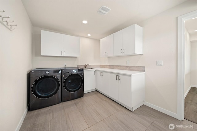 6409 NW 202nd Cir, Ridgefield, WA 98642 - laundry room with independent washer and dryer, baseboards, cabinet space, and recessed lighting