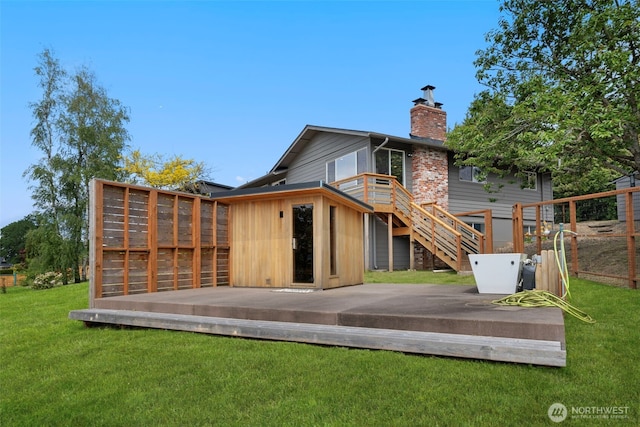 6409 NW 202nd Cir, Ridgefield, WA 98642 - back of house with a deck, a chimney, and stairway