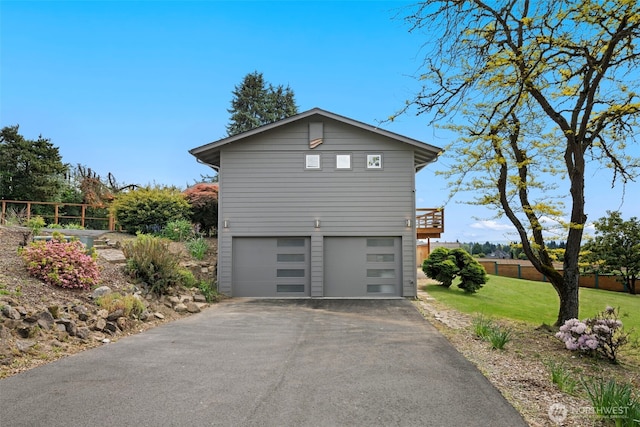 6409 NW 202nd Cir, Ridgefield, WA 98642 - view of property exterior featuring an attached garage and asphalt driveway