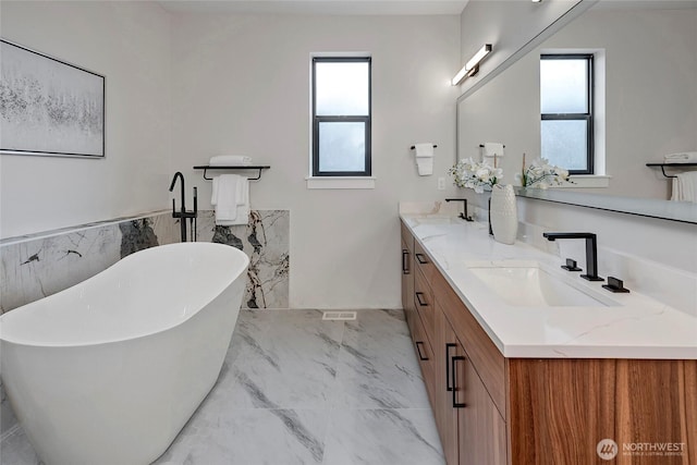 21403 39th Dr SE Unit B, Bothell, WA 98021 - full bathroom featuring marble finish flooring, plenty of natural light, double vanity, a soaking tub, and a wainscoted wall