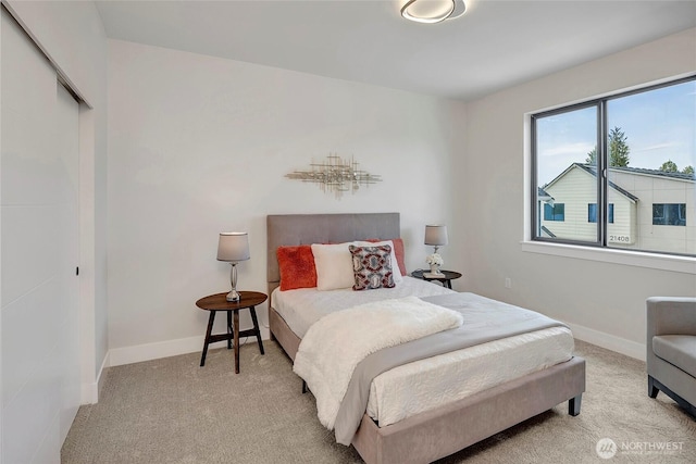 21403 39th Dr SE Unit B, Bothell, WA 98021 - bedroom featuring light colored carpet, baseboards, and a closet