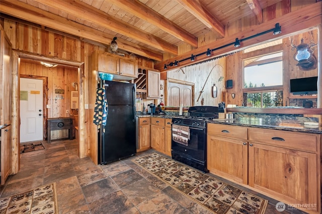 0 Boyd Rd, White Pass, WA 98377 - kitchen with stone finish flooring, beam ceiling, wooden ceiling, black appliances, and wooden walls