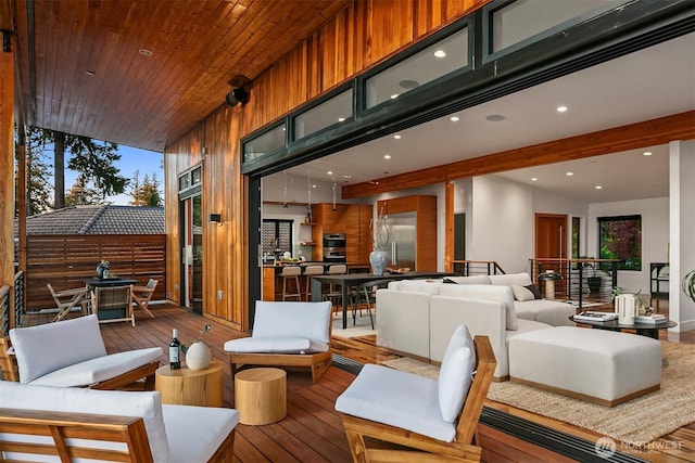 wooden deck featuring an outdoor hangout area and outdoor dining area