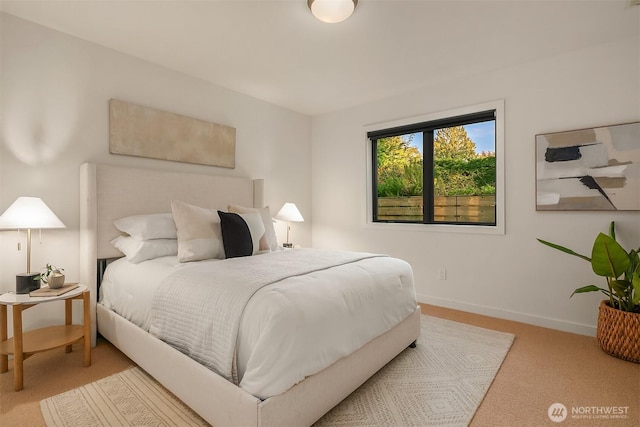 carpeted bedroom featuring baseboards