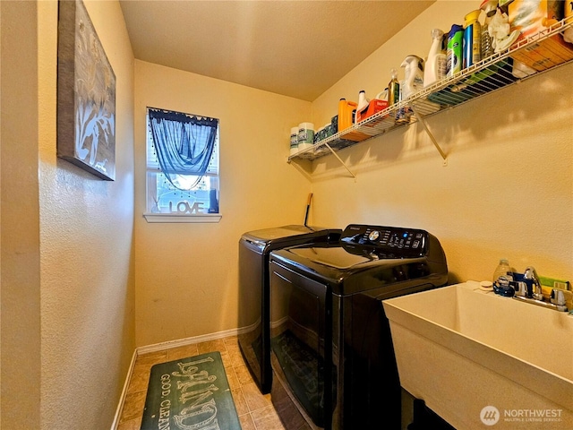 9011 Waverly Dr SW, Lakewood, WA 98499 - laundry area featuring washing machine and dryer, baseboards, and light tile patterned flooring