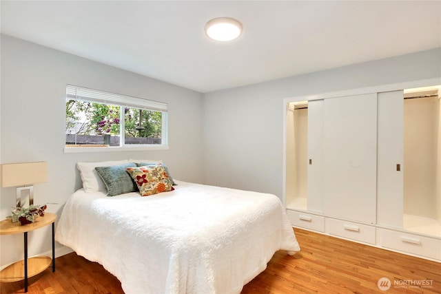 bedroom featuring a closet and wood finished floors
