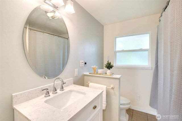 full bathroom with tile patterned floors, vanity, and toilet