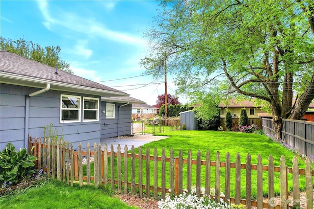 view of yard with a fenced backyard