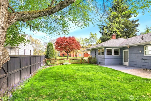 view of yard featuring a fenced backyard and a patio area