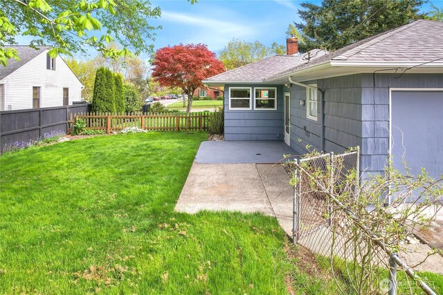 view of yard with a fenced backyard and a patio area