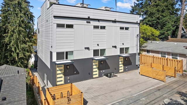 6032 42nd Ave SW Unit A, Seattle, WA 98136 - rear view of house featuring fence