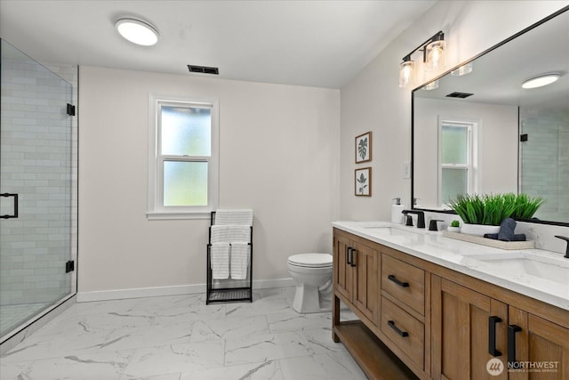 bathroom with a stall shower, marble finish floors, and plenty of natural light